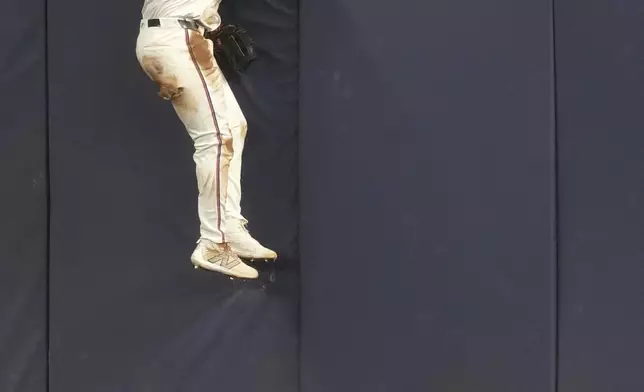 Miami Marlins outfielder Dane Myers (54) watches as Los Angeles Dodgers' Freddie Freeman (5) home run goes over the fence in center field during the third inning of a baseball game, Monday, May 5, 2025, in Miami. (AP Photo/Marta Lavandier)