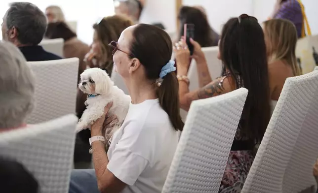 People attend the Palm Dog award ceremony at the 78th international film festival in Cannes, southern France, Friday, May 23, 2025. (AP Photo/Natacha Pisarenko)