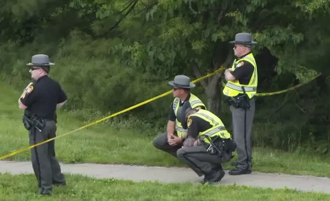 Police investigate the scene where a county deputy was struck and killed by a vehicle on Friday, May 2, 2025 in Cincinnati. (WCPO via AP)