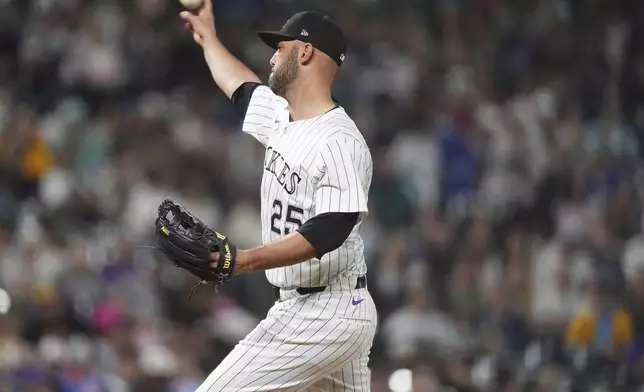 Normally a catcher, Colorado Rockies' Jacob Stallings works as a relief pitcher against the San Diego Padres in the eighth inning of a baseball game Saturday, May 10, 2025, in Denver. (AP Photo/David Zalubowski)