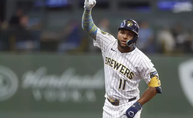 Milwaukee Brewers' Jackson Chourio reacts after his double against the Chicago Cubs during the third inning of a baseball game, Saturday, May 3, 2025, in Milwaukee. (AP Photo/Jeffrey Phelps)