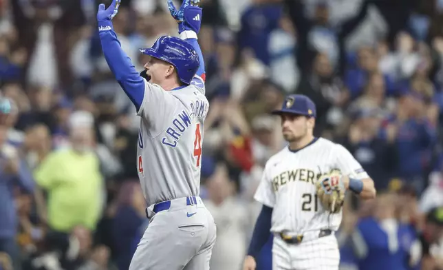 Chicago Cubs' Pete Crow-Armstrong, left, reacts after his three-run home run against the Milwaukee Brewers during the fourth inning of a baseball game, Saturday, May 3, 2025, in Milwaukee. (AP Photo/Jeffrey Phelps)