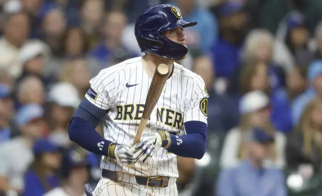 Milwaukee Brewers' Brice Turang watches his RBI single against the Chicago Cubs during the third inning of a baseball game, Saturday, May 3, 2025, in Milwaukee. (AP Photo/Jeffrey Phelps)