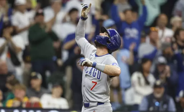 Chicago Cubs' Dansby Swanson reacts after his home run against the Milwaukee Brewers during the fourth inning of a baseball game, Saturday, May 3, 2025, in Milwaukee. (AP Photo/Jeffrey Phelps)