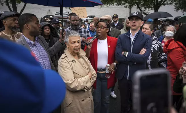 Rep. LaMonica McIver, center, demands the release of Newark Mayor Ras Baraka after his arrest while protesting outside an ICE detention prison, Friday, May 9, 2025, in Newark, N.J, (AP Photo/Angelina Katsanis)