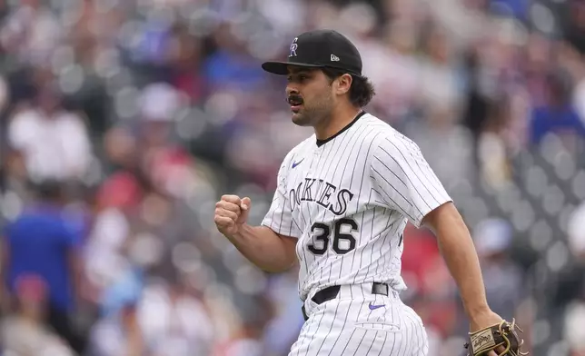 Colorado Rockies relief pitcher Zach Agnos reacts after retiring Atlanta Braves' Eli White to end a baseball game Wednesday, April 30, 2025, in Denver. (AP Photo/David Zalubowski)