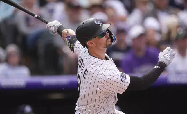 Colorado Rockies' Brenton Doyle flies out against the Atlanta Braves to end the eighth inning of a baseball game Wednesday, April 30, 2025, in Denver. (AP Photo/David Zalubowski)
