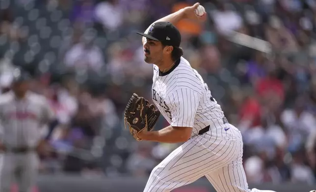 Colorado Rockies relief pitcher Zach Agnos works against the Atlanta Braves in the ninth inning of a baseball game Wednesday, April 30, 2025, in Denver. (AP Photo/David Zalubowski)