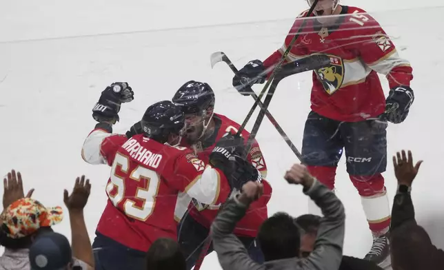 Florida Panthers center Brad Marchand (63) celebrates after scoring the game winning goal during overtime in Game 3 of a second-round NHL hockey playoff series Toronto Maple Leafs, Friday, May 9, 2025, in Sunrise, Fla. (AP Photo/Marta Lavandier)