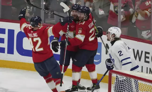 Florida Panthers center Carter Verhaeghe (23) celebrates after scoring a goal during the second period in Game 3 of a second-round NHL hockey playoff series, Friday, May 9, 2025, in Sunrise, Fla against the Toronto Maple Leafs. (AP Photo/Marta Lavandier)