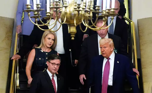 Speaker of the House Mike Johnson, R-La., and President Donald Trump arrive for a House Republican conference meeting, Tuesday, May 20, 2025, at the U.S. Capitol in Washington. (AP Photo/Julia Demaree Nikhinson)