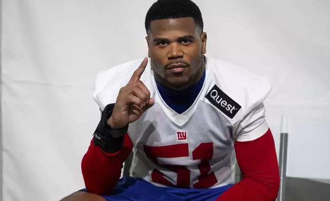 New York Giants linebacker Abdul Carter (51) poses after the NFL football team's rookie minicamp, Friday, May 9, 2025, in East Rutherford, N.J. (AP Photo/Angelina Katsanis)