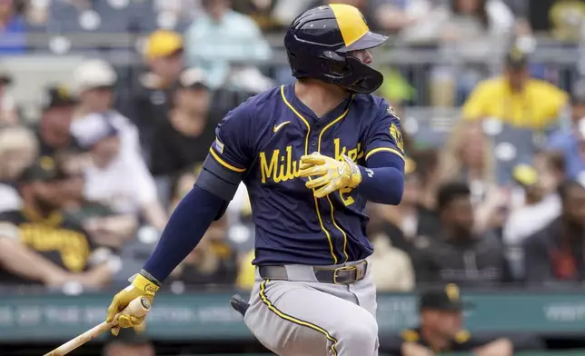 Milwaukee Brewers' Brice Turang watches his RBI double during the eighth inning of a baseball game against the Pittsburgh Pirates, Sunday, May 25, 2025, in Pittsburgh. (AP Photo/Matt Freed)