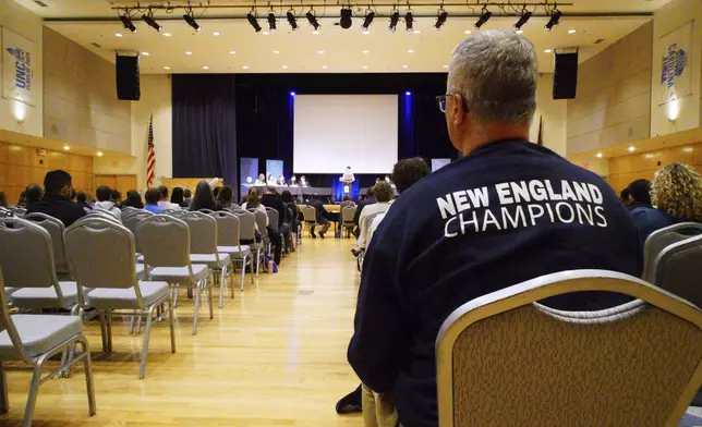 Spectators watch the finals of the National High School Ethics Bowl in in the student union of the University of North Carolina Chapel Hill, N.C., on Sunday, April 13, 2025. (AP Photo/Allen G. Breed)