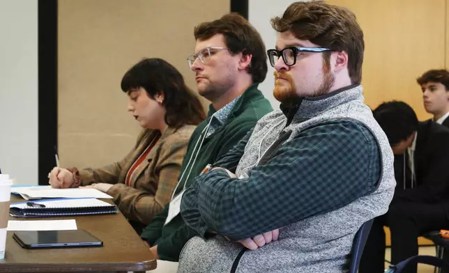 Three judges listen to questioning during a quarterfinal round of the National High School Ethics Bowl in Chapel Hill, N.C., on Sunday, April 13, 2025. (AP Photo/Allen G. Breed)