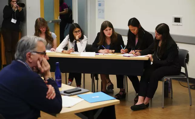 Students from Arizona's BASIS Flagstaff Charter School participate in the semifinal round of the National High School Ethics Bowl in Chapel Hill, N.C., on Sunday, April 13, 2025. (AP Photo/Allen G. Breed)
