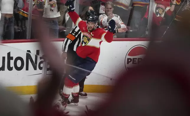 Florida Panthers' Aleksander Barkov reacts after scoring a goal during the third period against the Carolina Hurricanes in Game 3 of the NHL hockey Stanley Cup Eastern Conference finals Saturday, May 24, 2025, in Sunrise, Fla. (AP Photo/Lynne Sladky)