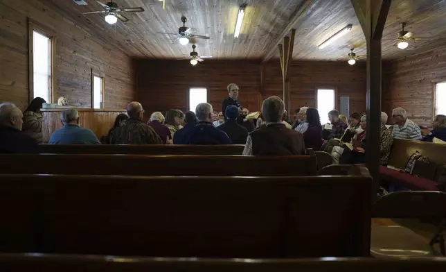 Matt Hinton, a shape-note singer, leads a song at a Sacred Harp singing event held at Holly Springs Primitive Baptist Church in Bremen, Ga., on Saturday, March 22, 2025. (AP Photo/Jessie Wardarski)