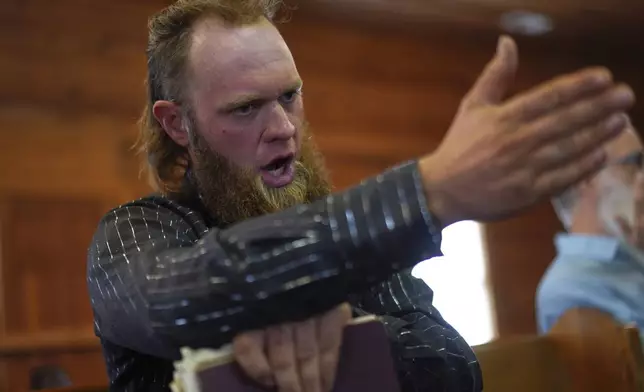 Isaac Green, 34, sings in the tenor section during a Sacred Harp singing event at Holly Springs Primitive Baptist Church in Bremen, Ga., on Sunday, March 23, 2025. (AP Photo/Jessie Wardarski)