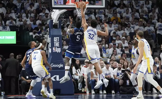 Minnesota Timberwolves guard Anthony Edwards (5) goes up for a shot as Golden State Warriors forward Trayce Jackson-Davis (32) defends during the first half of Game 2 of an NBA basketball second-round playoff series, Thursday, May 8, 2025, in Minneapolis. (AP Photo/Abbie Parr)