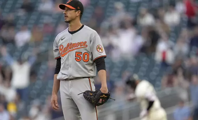 Baltimore Orioles starting pitcher Charlie Morton (50) stands on the mound after a three-run home run by Minnesota Twins' Byron Buxton (25) during the third inning of a baseball game Wednesday, May 7, 2025, in Minneapolis. (AP Photo/Abbie Parr)