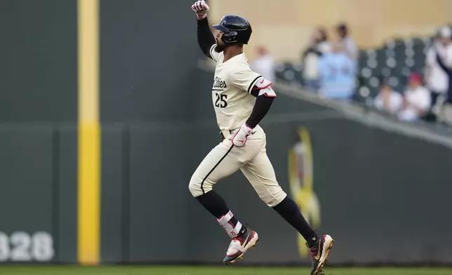 Minnesota Twins' Byron Buxton (25) runs the bases after hitting a three-run home run during the third inning of a baseball game against the Baltimore Orioles, Wednesday, May 7, 2025, in Minneapolis. (AP Photo/Abbie Parr)