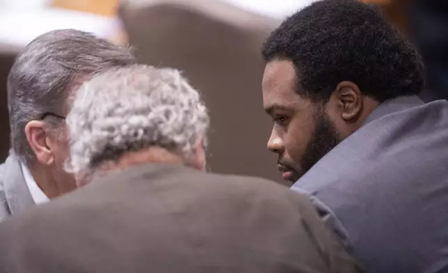 Former Memphis Police Department officer Demetrius Haley, right, speaks with his attorneys, Michael Stengel, left, and Stephen Leffler, center, during the sixth day of the trial for the death of Tyre Nichols in Memphis, Tenn., on Saturday, May 3, 2025. (Chris Day/Commercial Appeal/USA Today Network via AP, Pool)