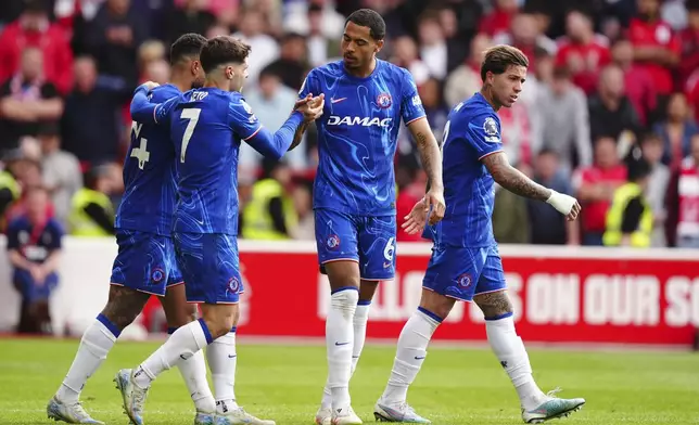 Chelsea's Levi Colwill, centre right, celebrates scoring the opening goal during the Premier League match at the City Ground, Nottingham, England, Sunday May 25, 2025. (Mike Egerton/PA via AP)