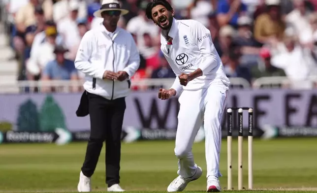 England's Shoaib Bashir celebrates the wicket of Zimbabwe's Sean Williams on day two of the Rothesay International test series match between England and Zimbabwe, at Trent Bridge, Nottingham, England, Friday May 23, 2025. (Mike Egerton/PA via AP)