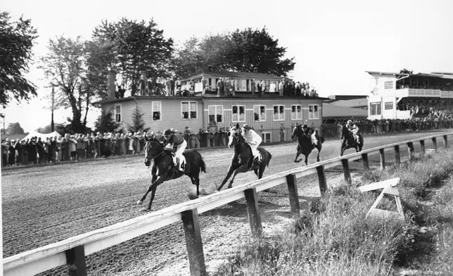 FILE - Citation, running easily, leads the Preakness field around the first turn at Pimlico Downs in Baltimore, Md., on May 15, 1948. Vulcan's Forge (2) is second, Bovard, third and Better Self, fourth. That was also the order of the finish. Eddie Arcaro guided Citation during the race. (AP Photo/File)