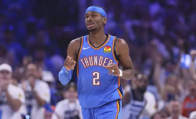 Oklahoma City Thunder guard Shai Gilgeous-Alexander (2) points during the first half of Game 5 of the Western Conference finals of the NBA basketball playoffs against the Minnesota Timberwolves, Wednesday, May 28, 2025, in Oklahoma City. (AP Photo/Nate Billings)