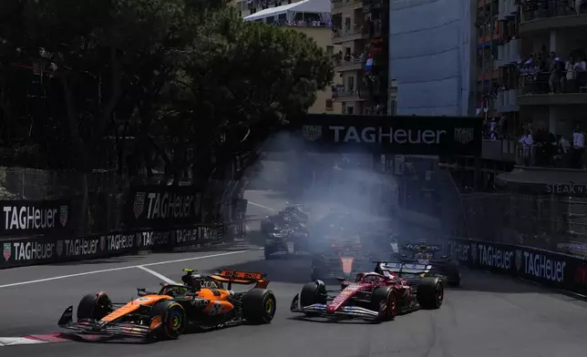 McLaren driver Lando Norris of Britain leads the field after the start during the Formula One Monaco Grand Prix race at the Monaco racetrack in Monaco, Sunday, May 25, 2025. (AP Photo/Manu Fernandez)
