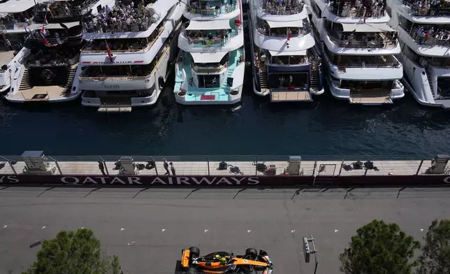 McLaren driver Lando Norris of Britain steers his car during the Formula One Monaco Grand Prix race at the Monaco racetrack in Monaco, Sunday, May 25, 2025. (AP Photo/Manu Fernandez)