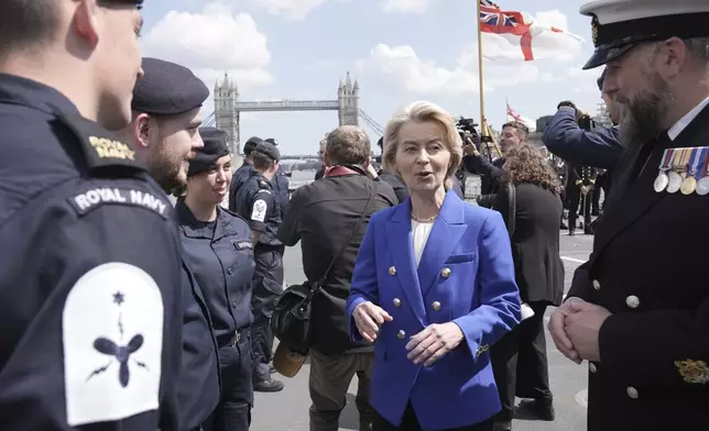 President of the European Commission Ursula von der Leyen speaks with members of the Royal Navy on board Type 23 frigate HMS Sutherland in central London, following the UK-EU Summit, Monday, May 19, 2025. (Stefan Rousseau/Pool Photo via AP)