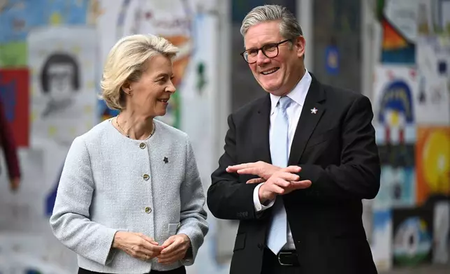 FILE - Ursula von der Leyen, President of the European Commission, left, and Keir Starmer, Prime Minister of the United Kingdom greet each other, ahead of their bilateral meeting at the 6th European Political Community summit Friday May 16, 2025 in Tirana, Albania. (Leon Neal/Pool via AP, File)