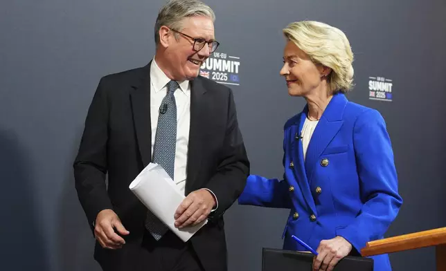 Britain's Prime Minister Keir Starmer, left, and European Commission President Ursula von der Leyen smile as they leave at the end of a joint press conference with European Council President Antonio Costa following a United Kingdom and European Union summit at Lancaster House, London, Monday, May 19, 2025. (Carl Court/Pool Photo via AP)