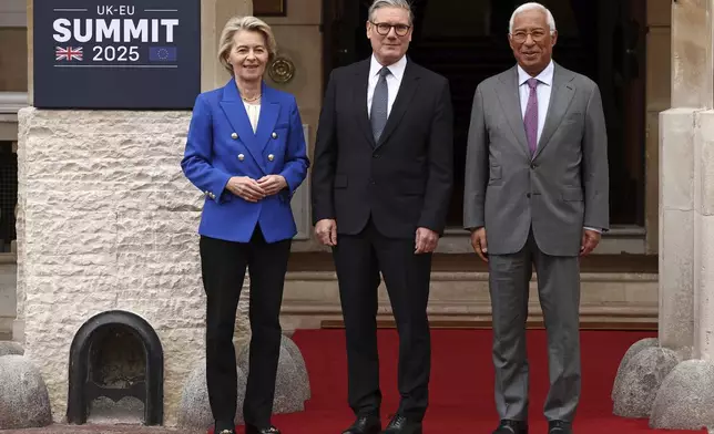 Britain's Prime Minister Keir Starmer, center, stands for a photo with European Commission President Ursula von der Leyen and European Council President Antonio Costa, right, ahead of a United Kingdom and European Union summit at Lancaster House, London, Monday, May 19, 2025. (Henry Nicholls/Pool Photo via AP)