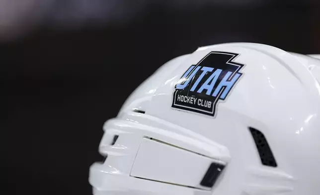 FILE - The Utah Hockey Club logo is seen on the helmet of center Nick Schmaltz (8) during the third period of an NHL hockey game against the Minnesota Wild Friday, Dec. 20, 2024, in St. Paul, Minn. (AP Photo/Matt Krohn, File)