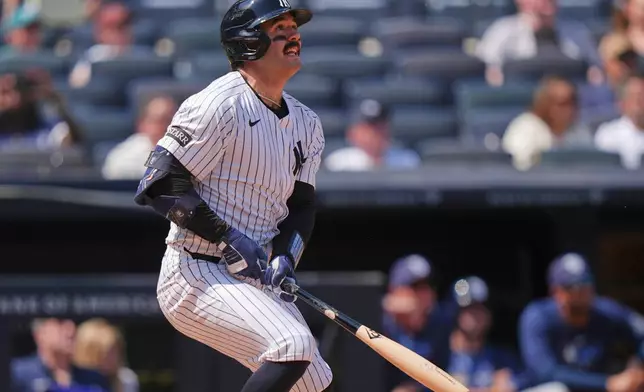 New York Yankees' Austin Wells follows through on a home run during the fifth inning of a baseball game against the Tampa Bay Rays, Saturday, May 3, 2025, in New York. (AP Photo/Frank Franklin II)