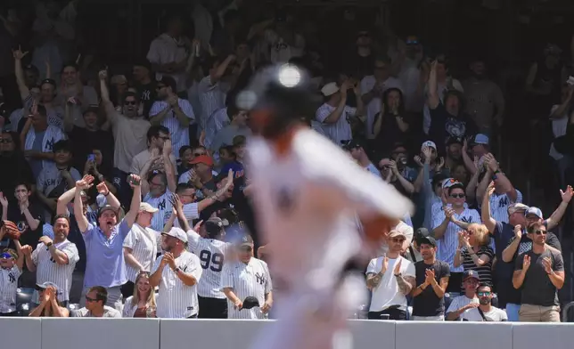 Fans cheer for New York Yankees' Aaron Judge as he runs the bases after hitting a home run during the first inning of a baseball game against the Tampa Bay Rays, Saturday, May 3, 2025, in New York. (AP Photo/Frank Franklin II)