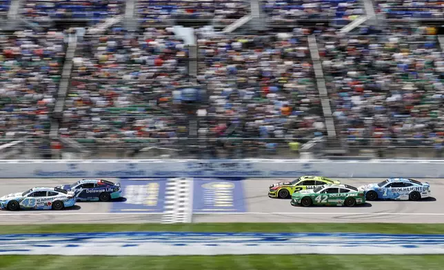 Drivers head down the front straightaway during a NASCAR Cup Series auto race at Kansas Speedway in Kansas City, Kan., Sunday, May 11, 2025. (AP Photo/Colin E. Braley)