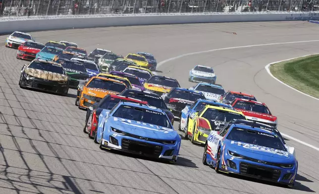 Drivers head through Turn 1 during a NASCAR Cup Series auto race at Kansas Speedway in Kansas City, Kan., Sunday, May 11, 2025. (AP Photo/Colin E. Braley)