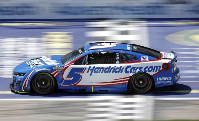 Kyle Larson crosses the start/finish line during the first stage of a NASCAR Cup Series auto race at Kansas Speedway in Kansas City, Kan., Sunday, May 11, 2025. (AP Photo/Colin E. Braley)