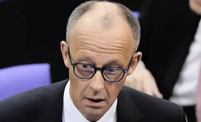 Friedrich Merz reacts after he fell short of votes need to be chancellor in first round vote at the parliament Bundestag in Berlin, Tuesday, May 6, 2025. (AP Photo/Markus Schreiber)