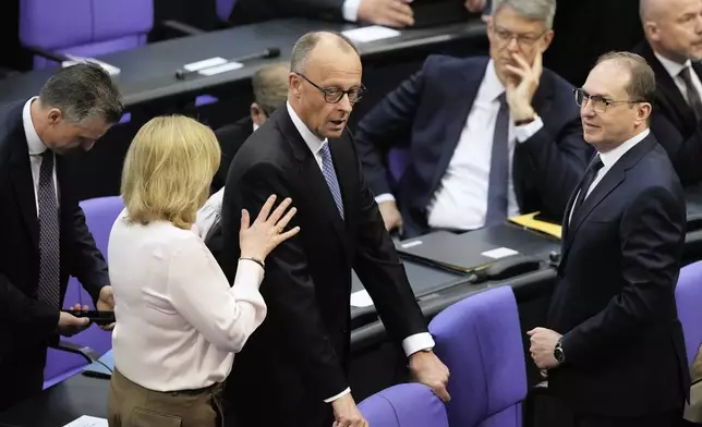 Friedrich Merz reacts after he was not elected new Chancellor in the first voting process at the parliament Bundestag in Berlin, Tuesday, May 6, 2025. (AP Photo/Markus Schreiber)