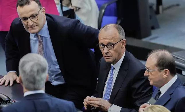 Friedrich Merz, 2nd right, reacts after he was not elected new Chancellor in the first voting process at the parliament Bundestag in Berlin, Tuesday, May 6, 2025.(AP Photo/Ebrahim Noroozi)