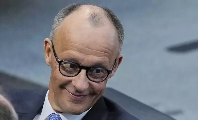 Friedrich Merz waits for the beginning of a session where he is supposed to be elected new Chancellor in the German federal parliament, Bundestag, at the Reichstag building in Berlin, Tuesday, May 6, 2025. (AP Photo/Ebrahim Noroozi)