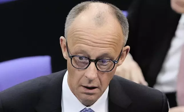 Friedrich Merz reacts after he failed to be elected new chancellor in the first voting process at the German federal parliament, Bundestag, at the Reichstag building in Berlin, Tuesday, May 6, 2025. (AP Photo/Markus Schreiber)