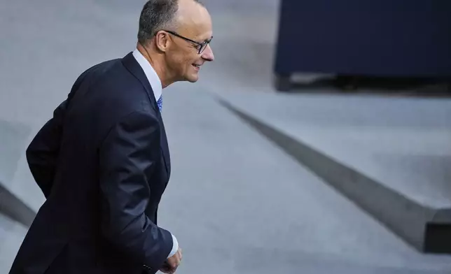 Friedrich Merz waits for the beginning of a session where he is supposed to be elected new Chancellor in the parliament Bundestag in Berlin, Tuesday, May 6, 2025. (AP Photo/Ebrahim Noroozi)