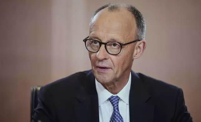 Newly-elected German Chancellor Friedrich Merz attends the first cabinet meeting, at the chancellery in Berlin, late Tuesday, May 6, 2025. (AP Photo/Ebrahim Noroozi)